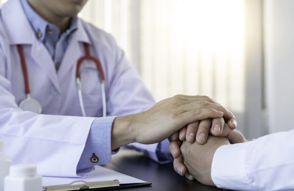 The doctor or pharmacist is discussing and encouraging the results of the treatment. With the patients who were examined, counseling ideas and treatment guidelines